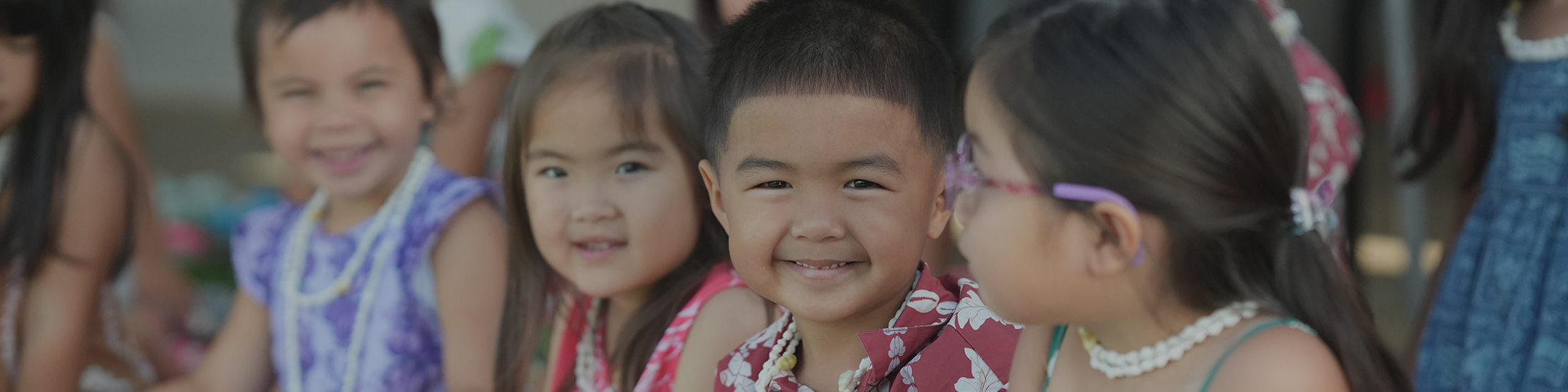 image of students sitting and smiling at Hongwanji Mission School